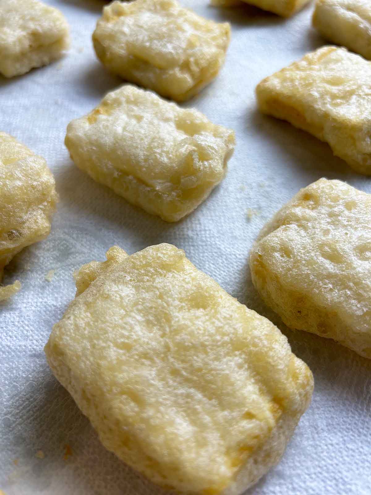 crispy tofu drying on paper towels