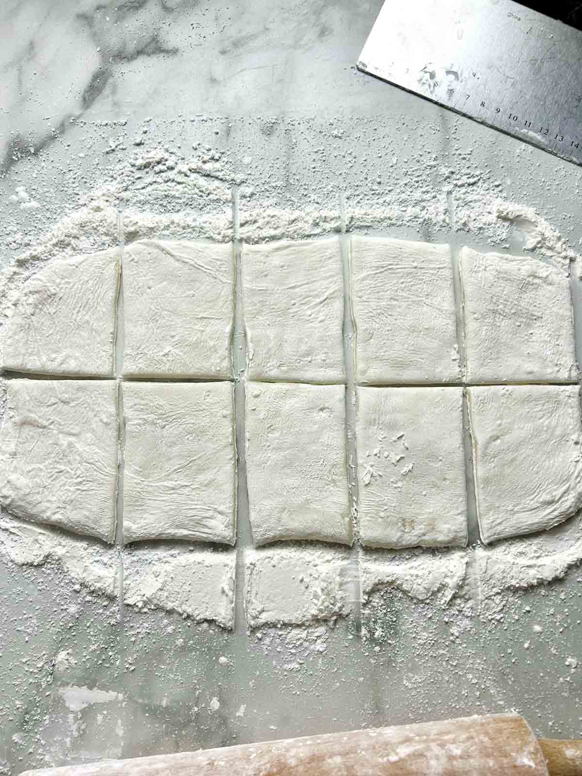 flattened mochi dough cut into ten sections