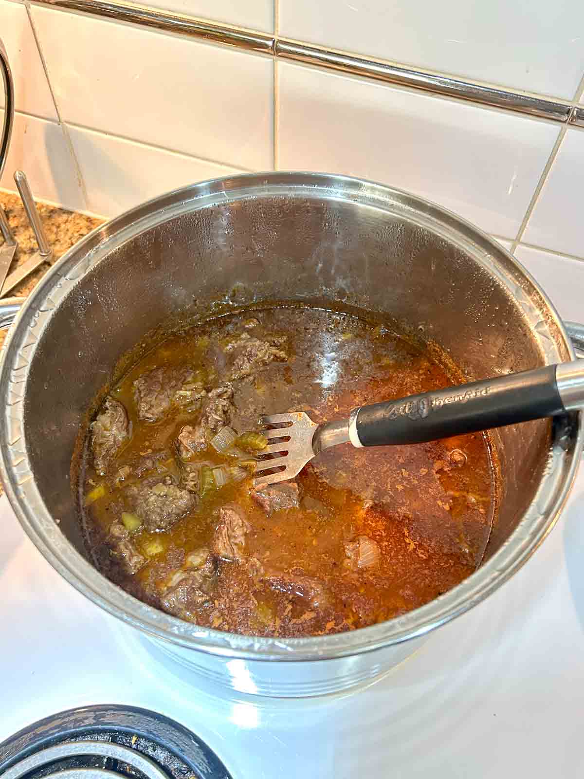 beef and seasonings added to stew.