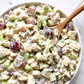 chicken salad in bowl with spoon in it.