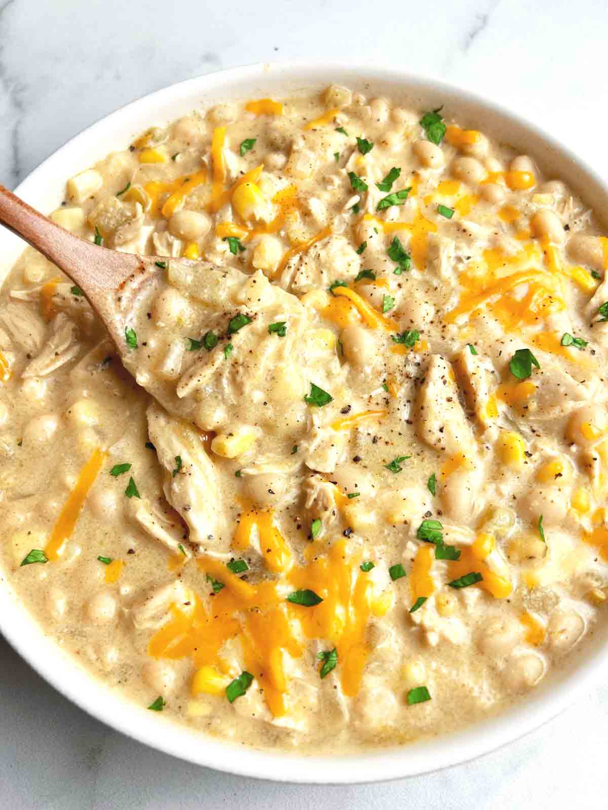 close up of white chicken chili in bowl.