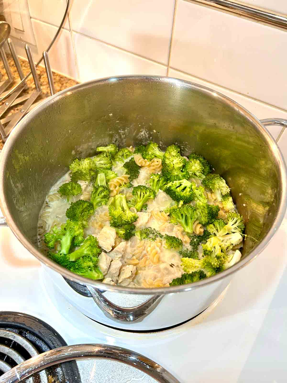 broccoli florets added to the pot.