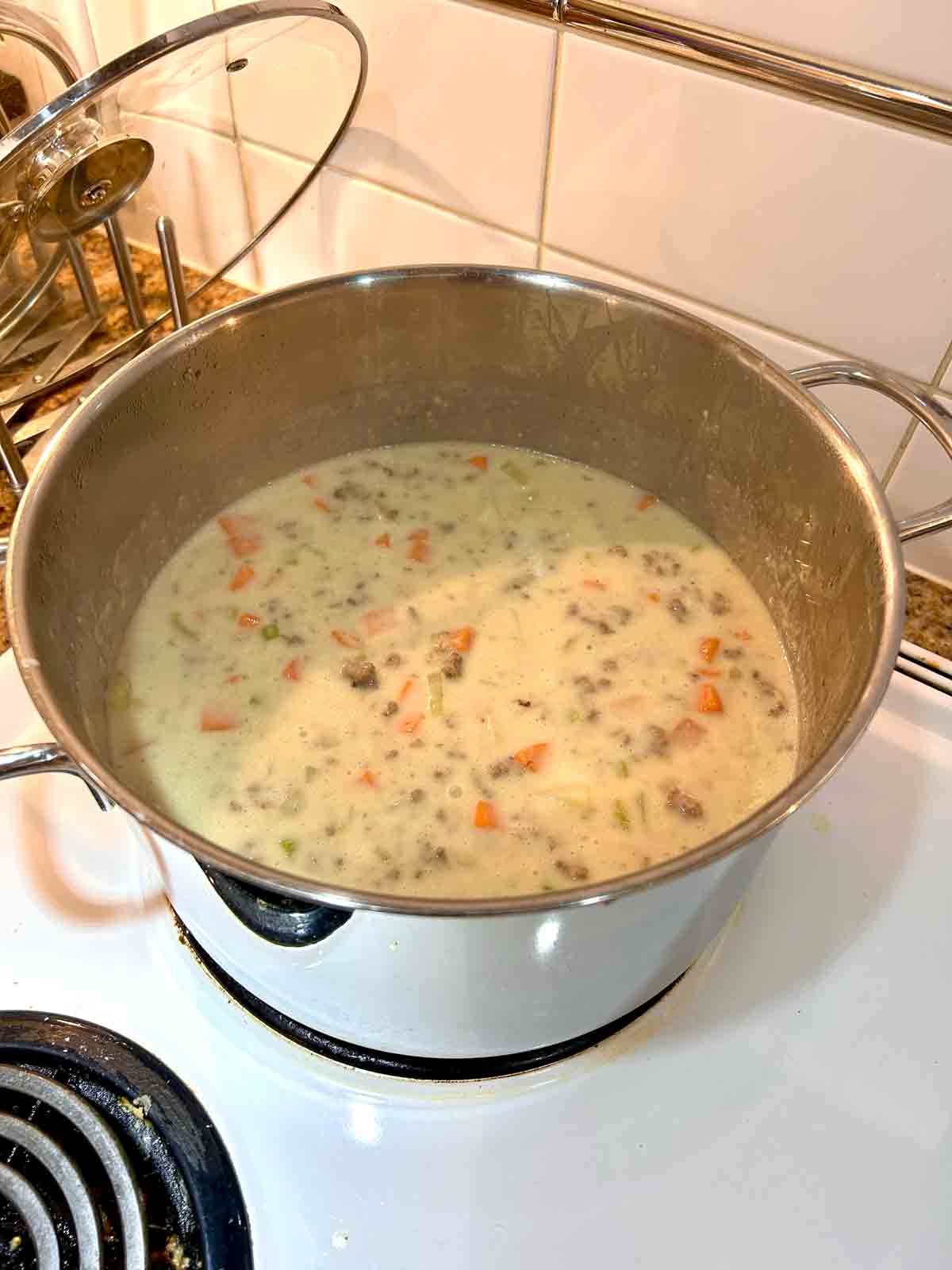 stock, cream, beef, and potatoes added to pot.