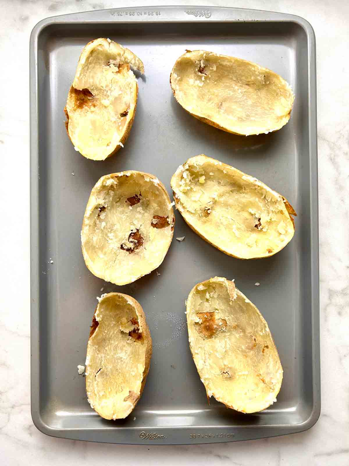 potato skins on baking sheet.