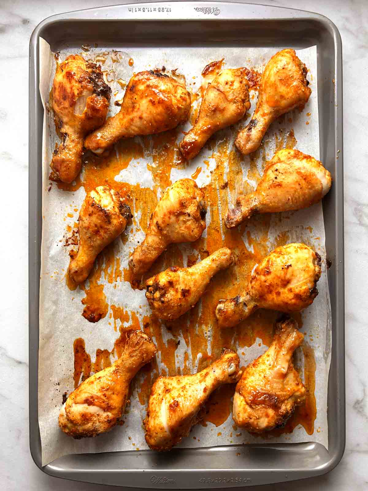 chicken legs after baking; golden brown skin.