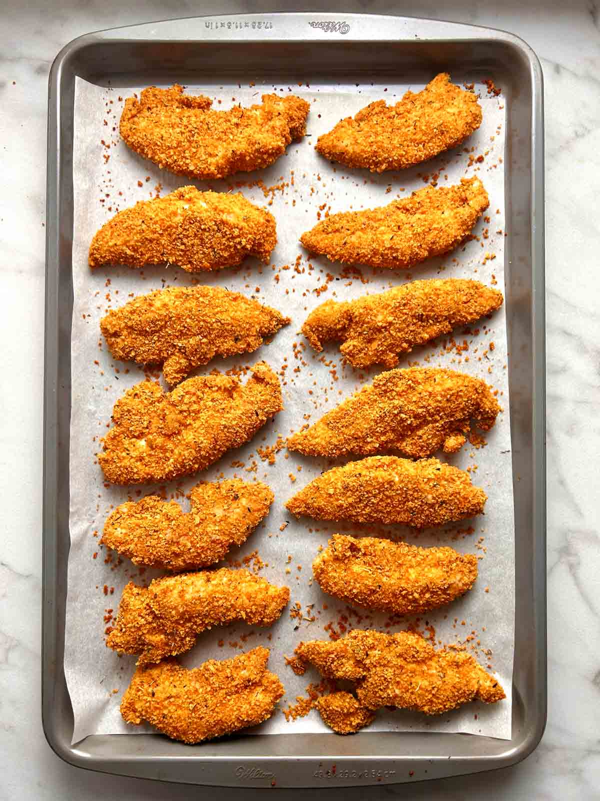 breaded chicken tenders and baking.