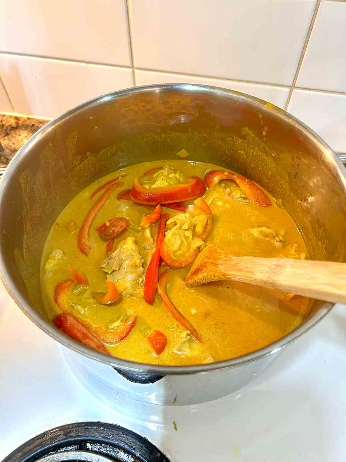 red bell pepper added to pot.