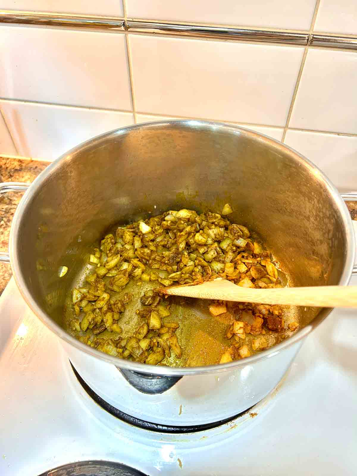 curry powder added to pot.