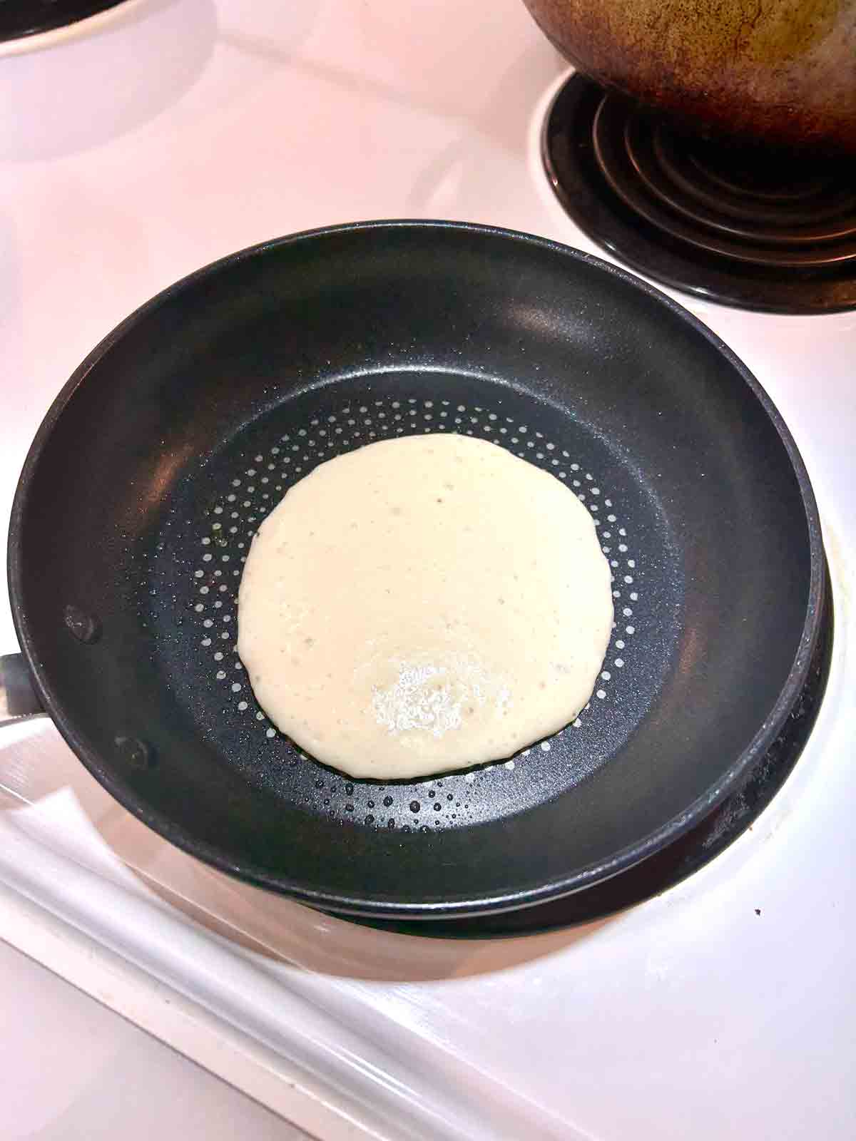 batter cooking in pan.