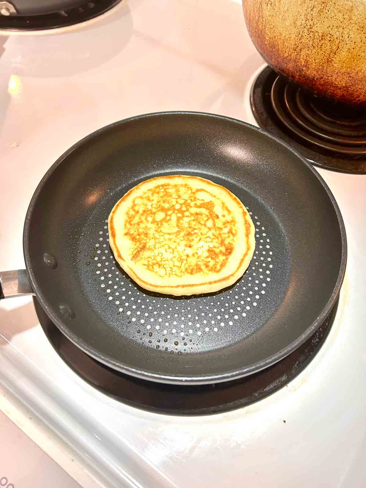 pancake flipped to show golden brown side.