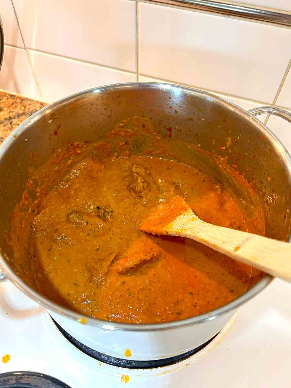 cream, kasoori methi, and chicken added to pot.