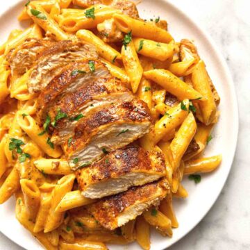close up of cajun chicken pasta on plate.