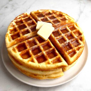 stack of keto waffles on plate.