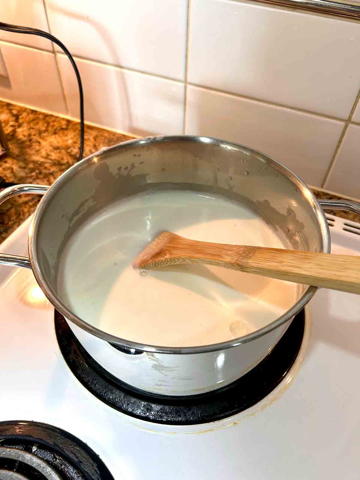 add milk, rice, and sugar to pot.