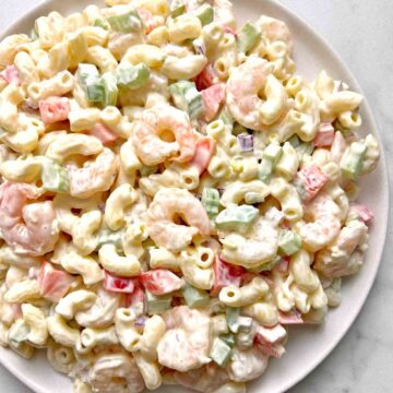 close up of shrimp pasta salad on plate.
