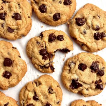 baked chocolate chip cookies on parchment paper.
