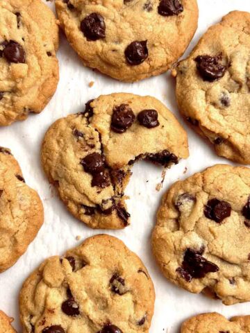 baked chocolate chip cookies on parchment paper.