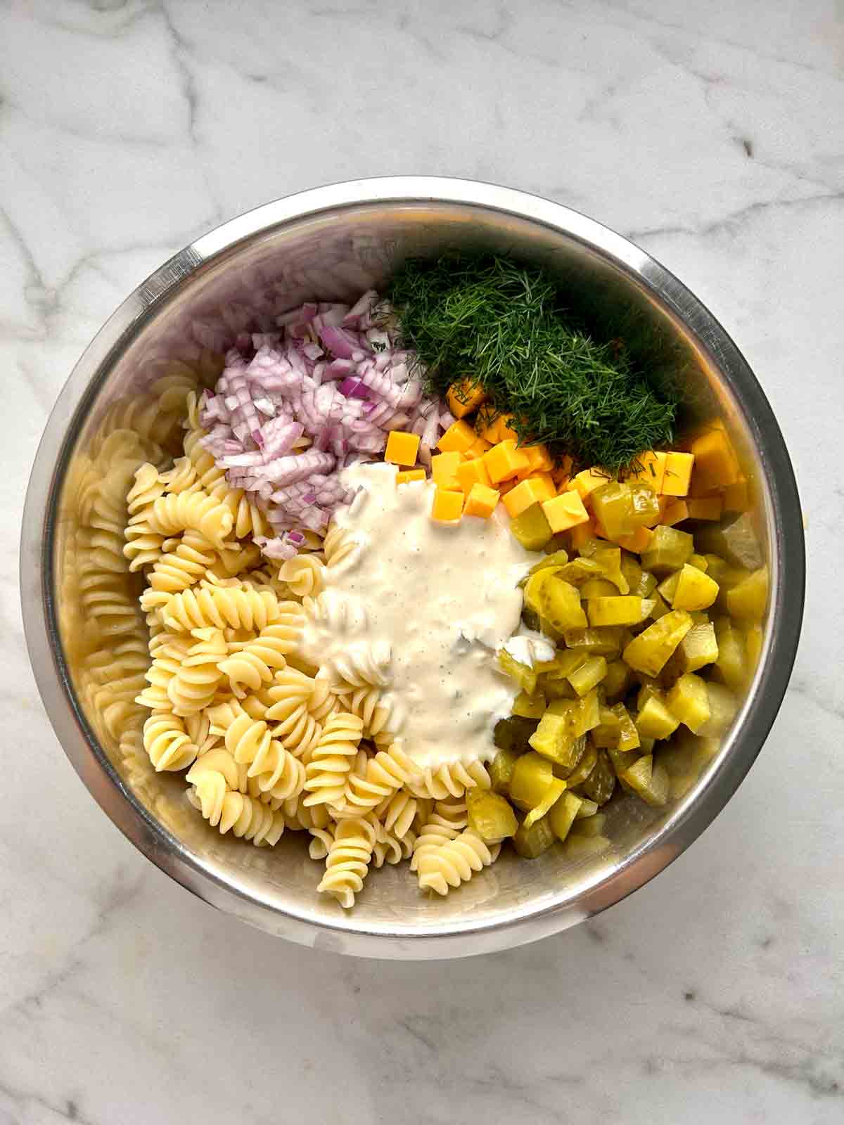 all salad components in bowl.