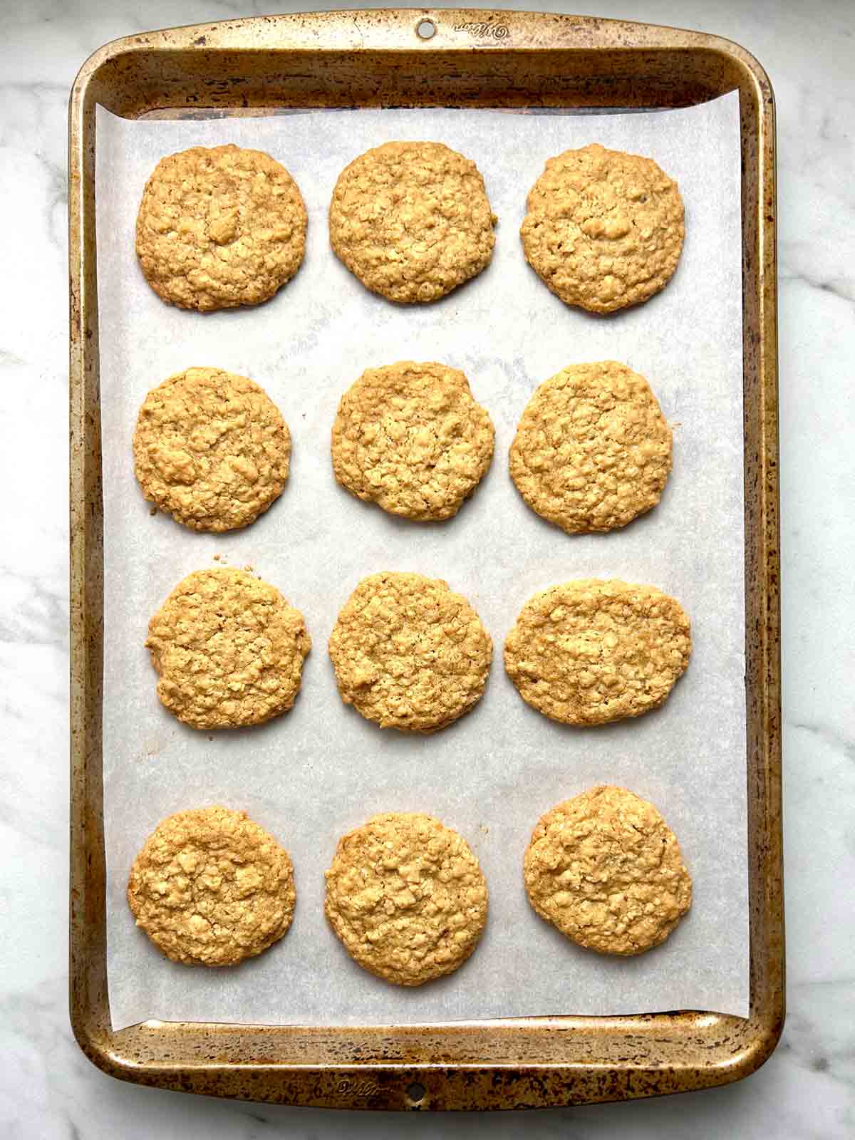 oatmeal cookies on baking sheet after baking.