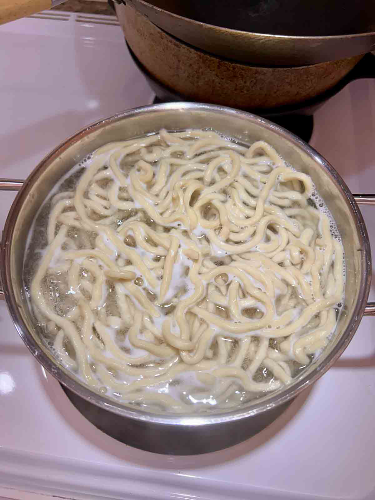 noodles cooking in water.