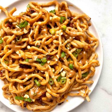 overhead shot of peanut noodles on plate.