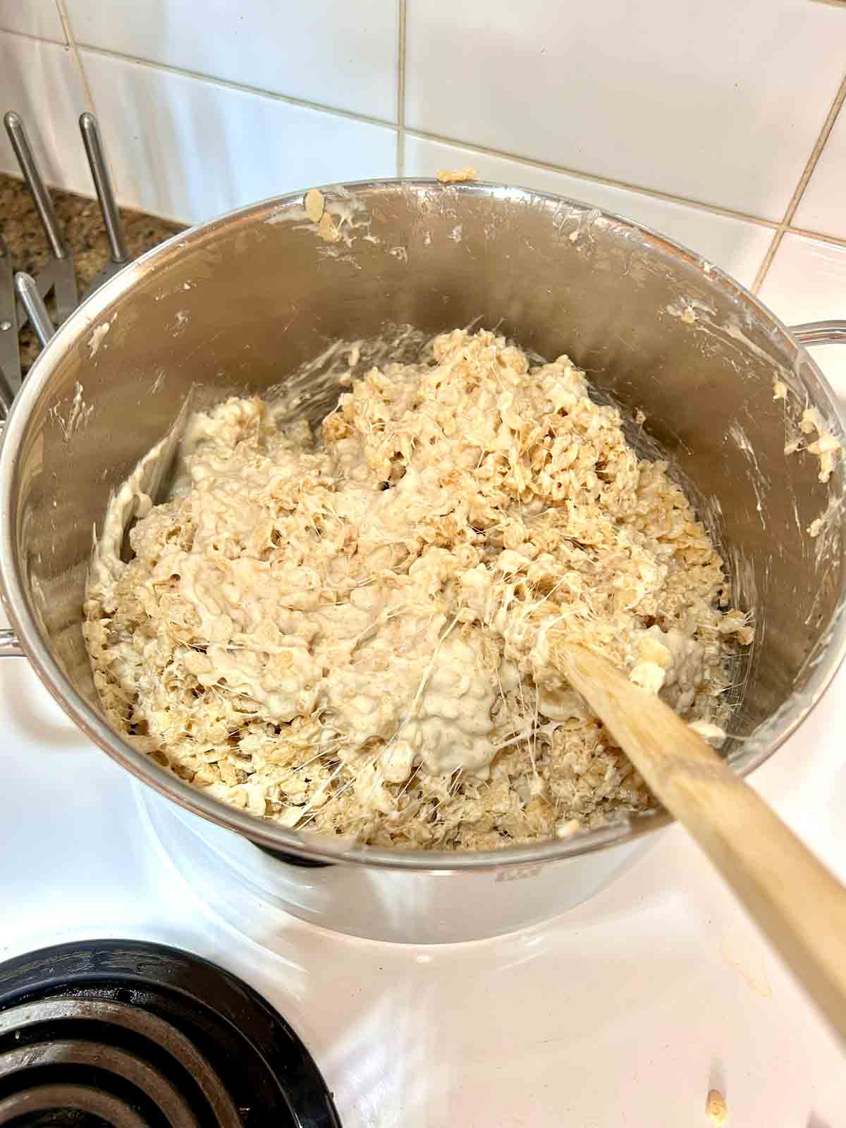 cereal added to pot of marshmallow and butter mixture.