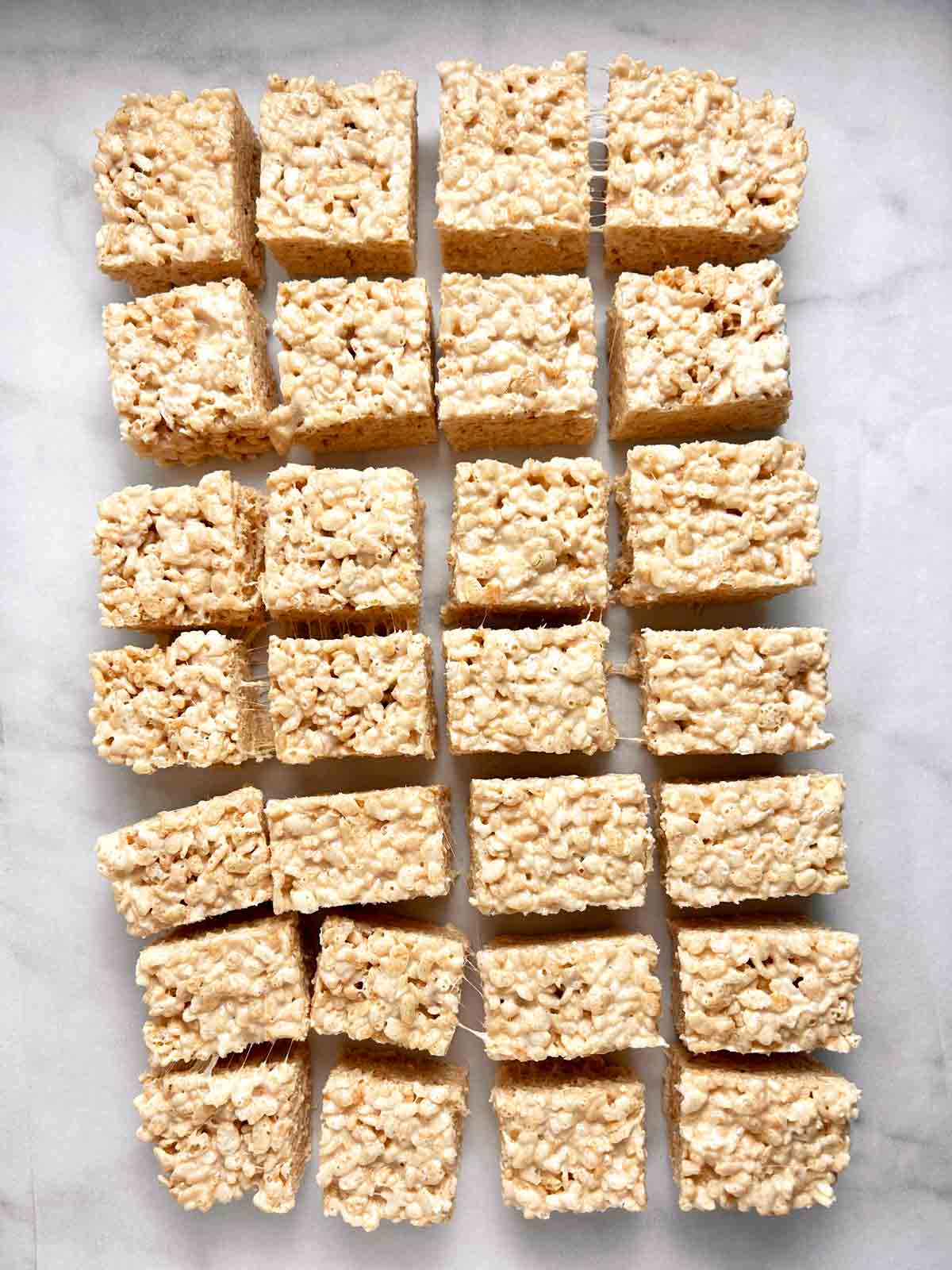 Rice Krispies treats cut into squares.