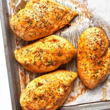 baked chicken breasts on baking sheet.