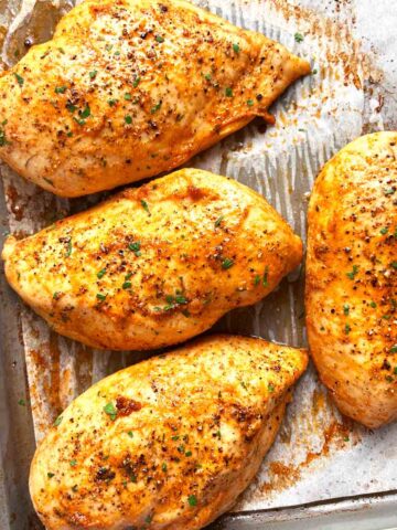 baked chicken breasts on baking sheet.
