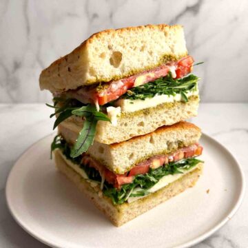 two slices of focaccia sandwich stacked on top of each other.