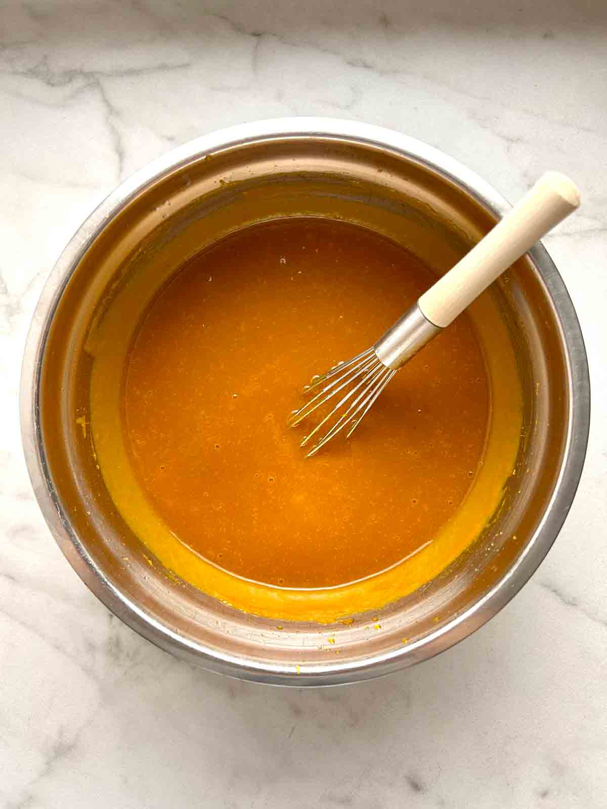 eggs and vanilla whisked into wet mixture.