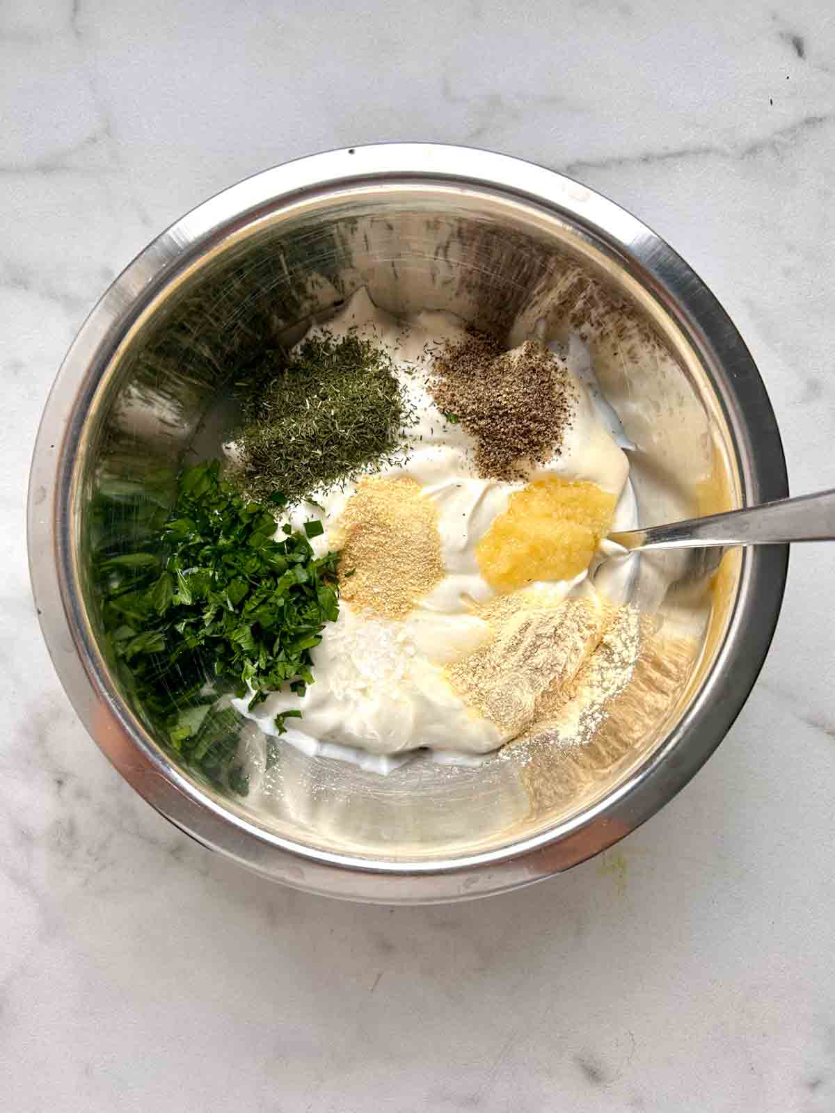 dressing ingredients in bowl, unmixed.