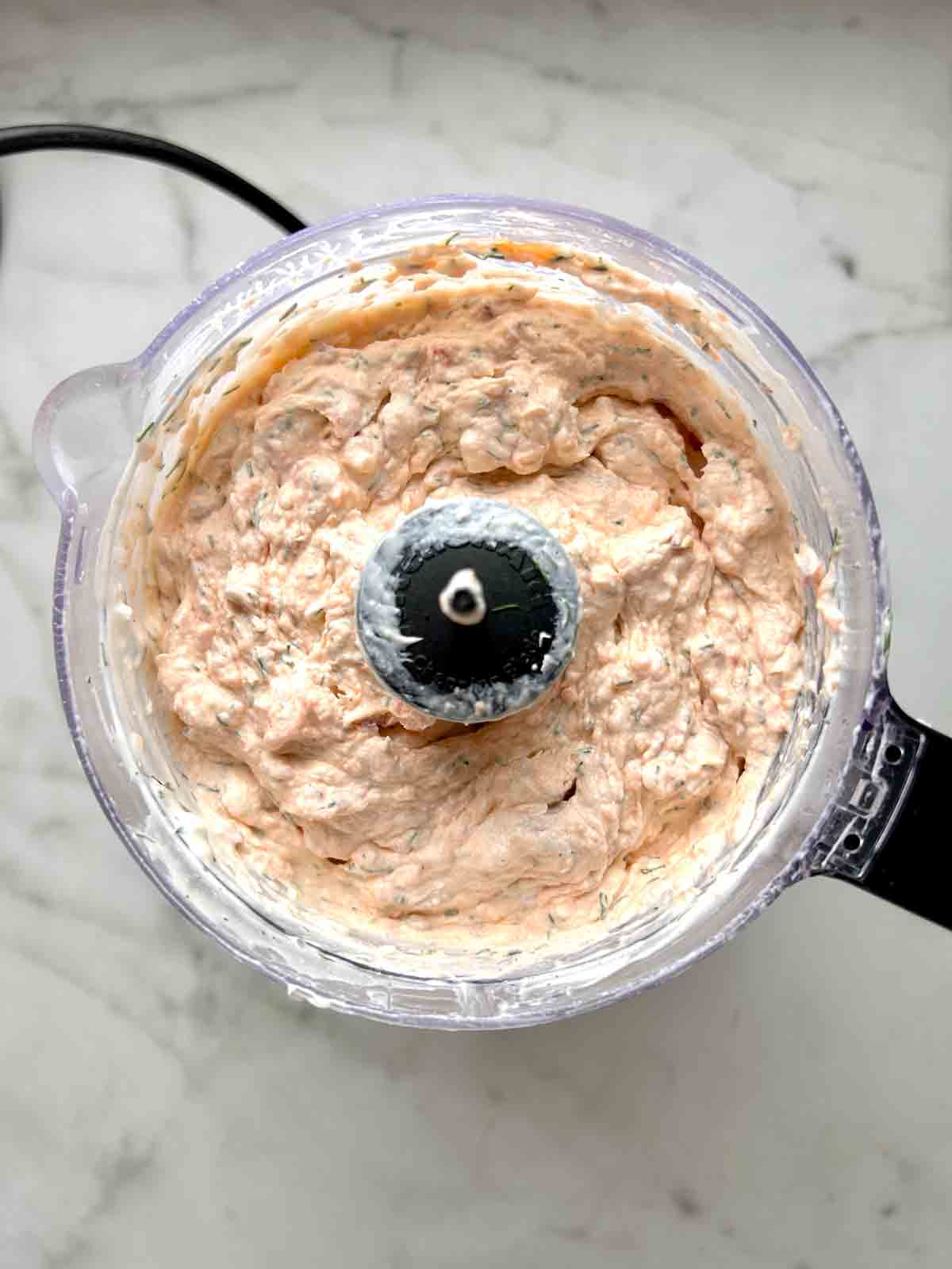 salmon dip after being blended in food processor.