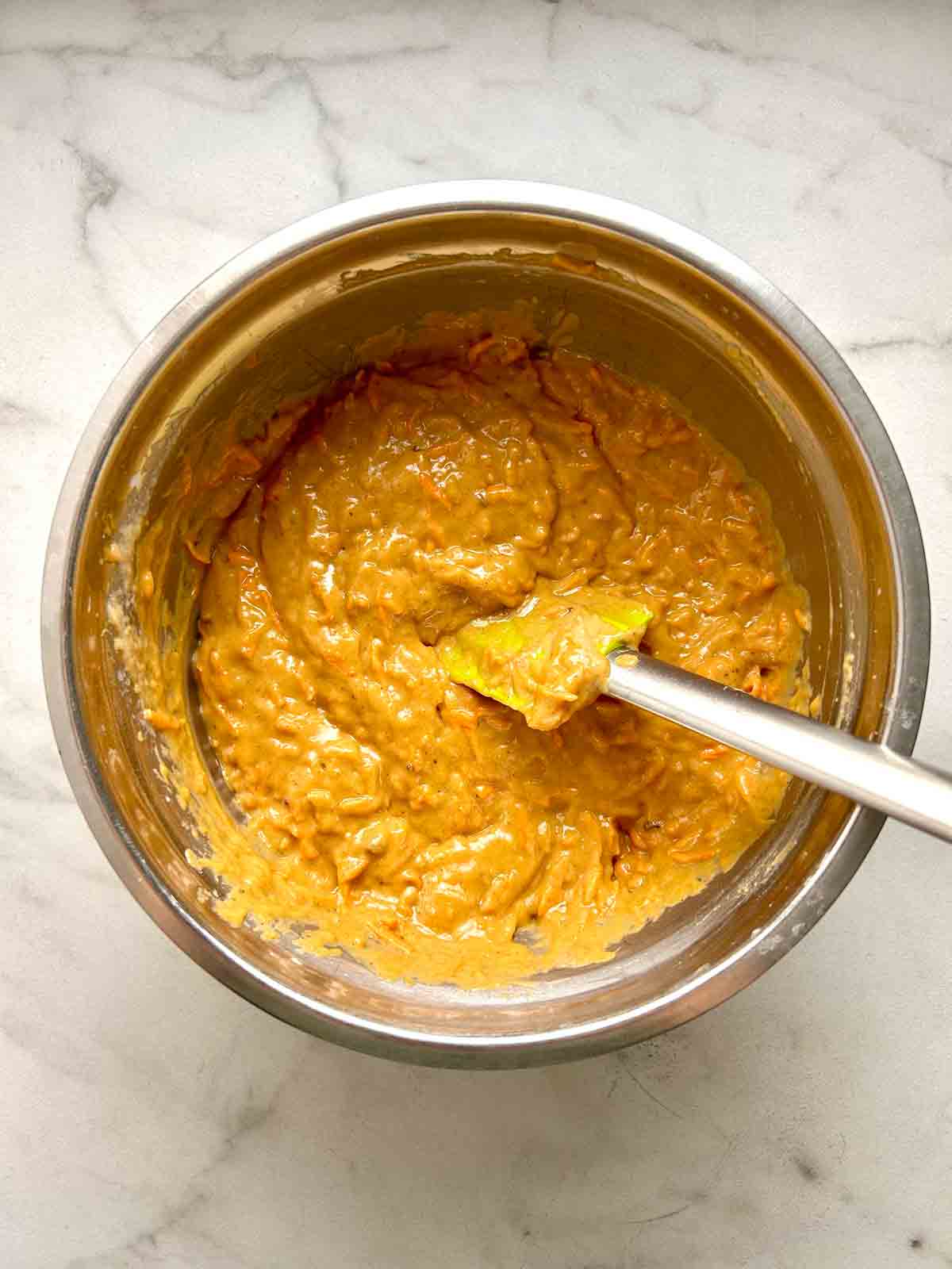 shredded carrots folded into batter.