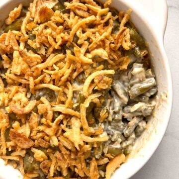close up of green bean casserole with portion scoped out of it.