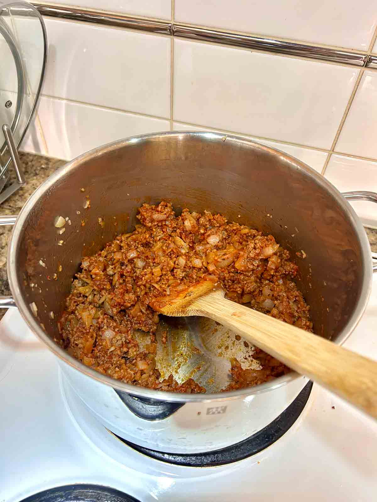 tomato paste stirred into Italian sausages, onions, and garlic.