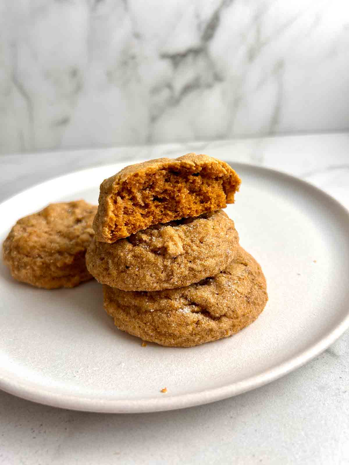 pumpkin cookie split in half to show inside.