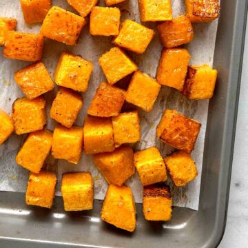 close up of roasted butternut squash in pan.