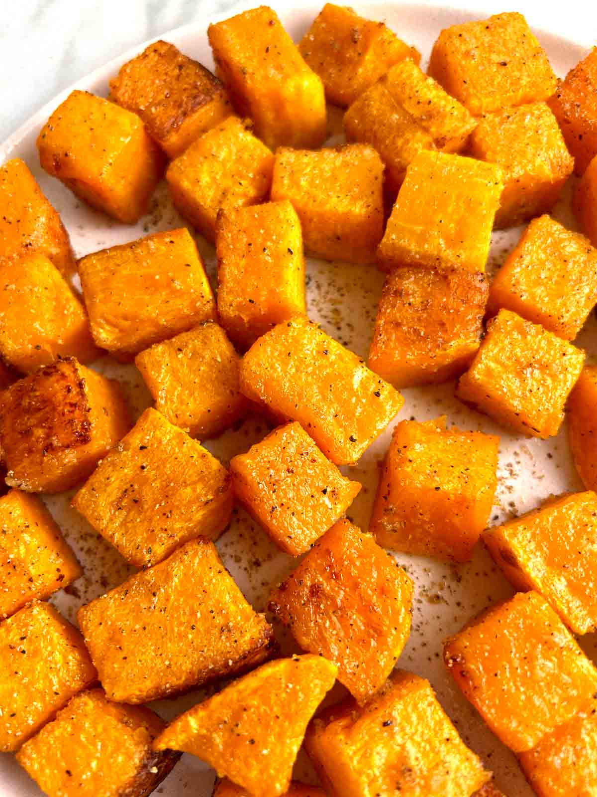close up of roasted butternut squash in pan.