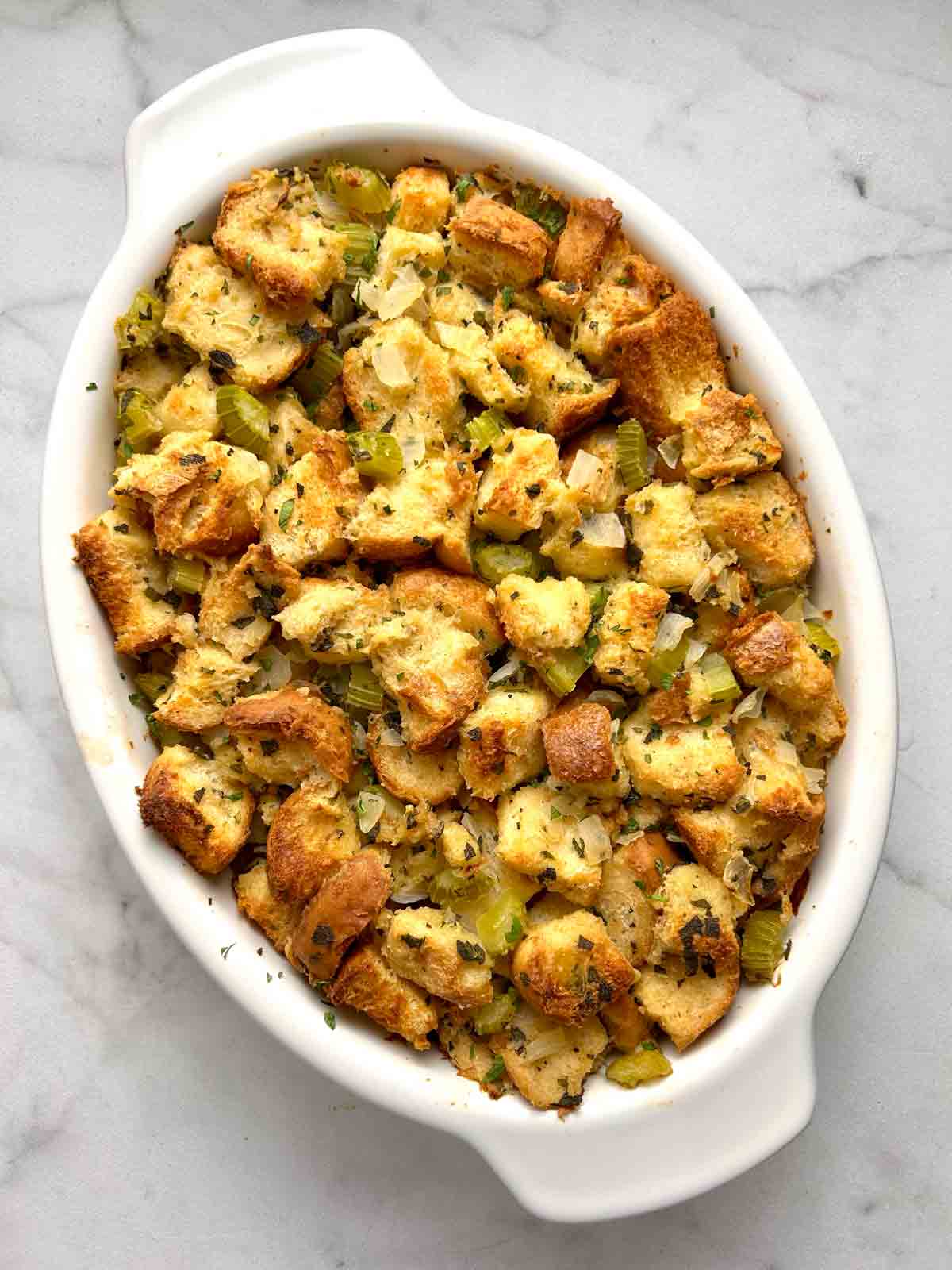 overhead shot of stuffing in casserole dish after baking.