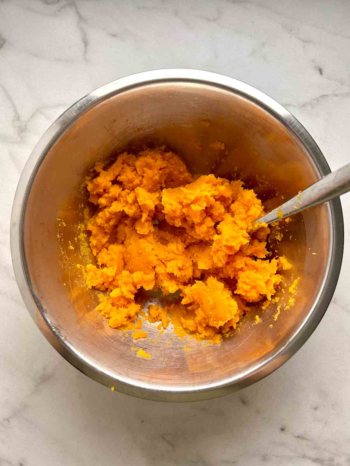 sweet potatoes mashed in bowl.