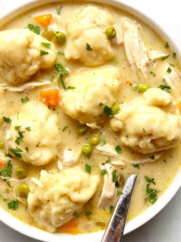 close up on bowl of chicken and dumplings.