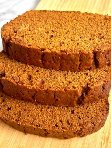 3 slices of gingerbread stack on top of each other.