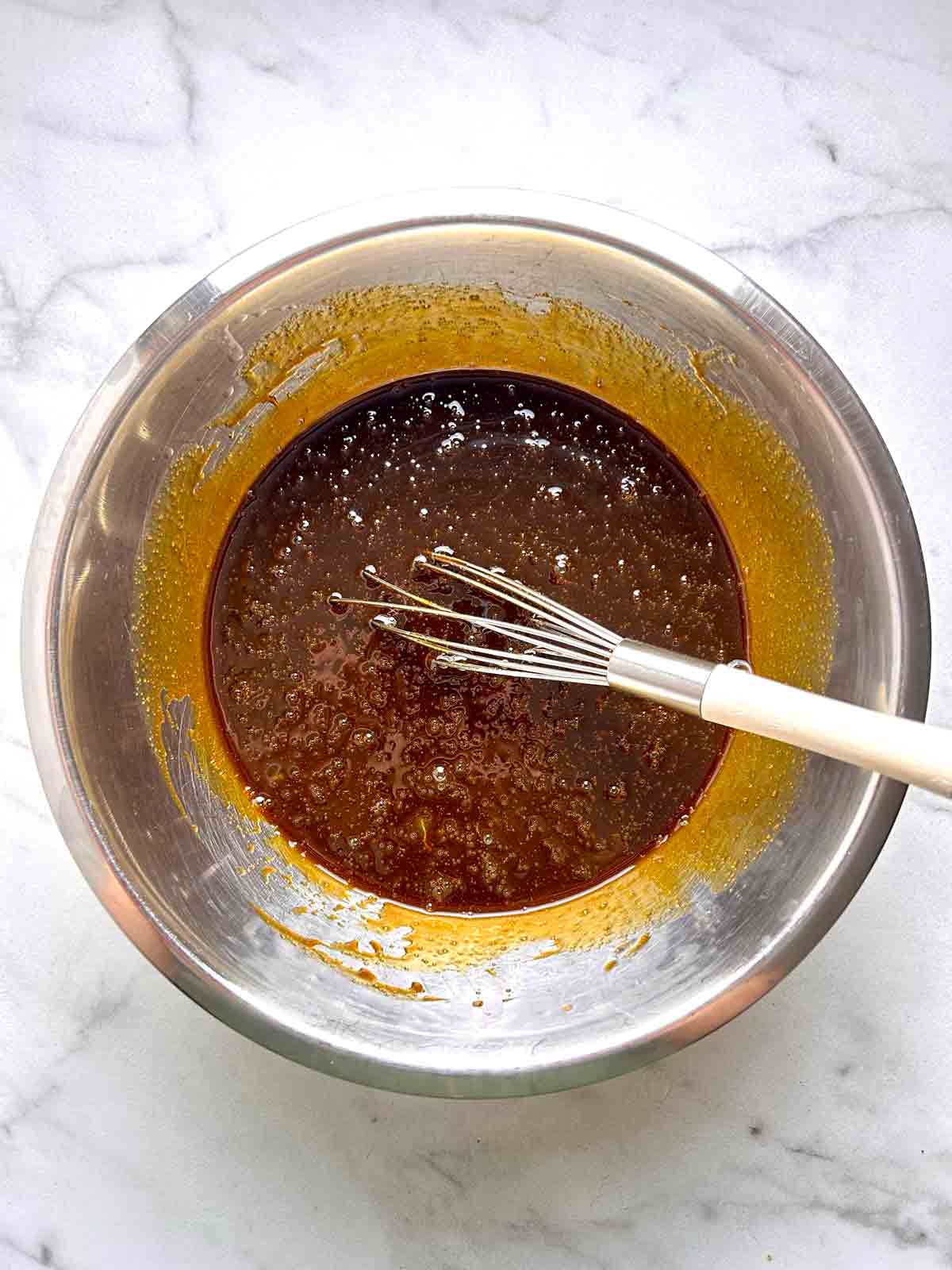wet mixture whisked in bowl.