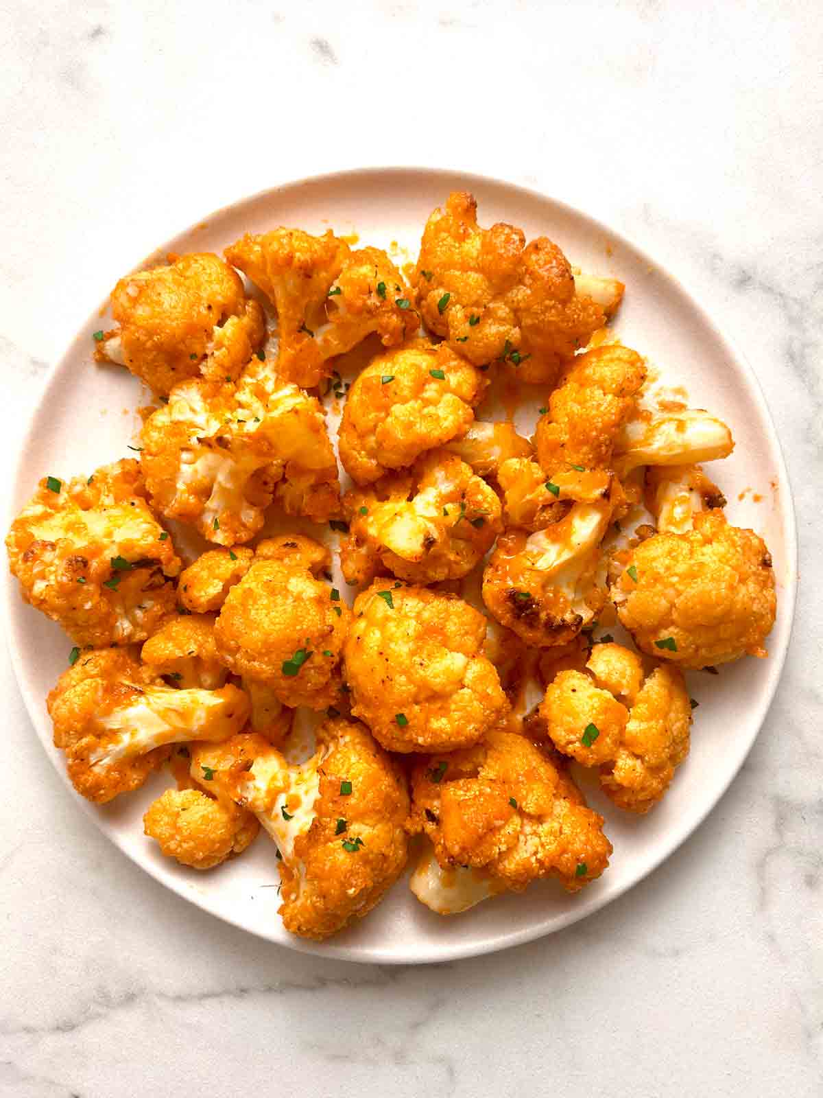 buffalo cauliflower wings on plate.