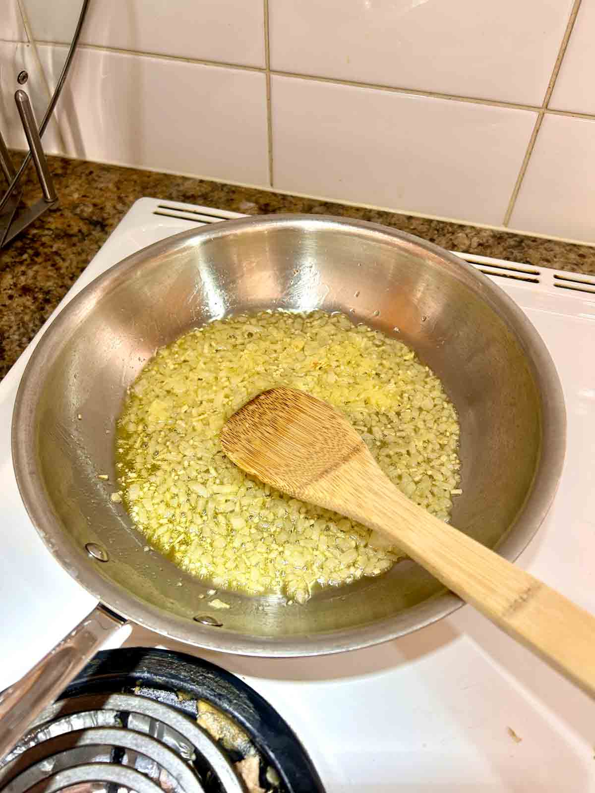 onions and garlic cooking in skillet.