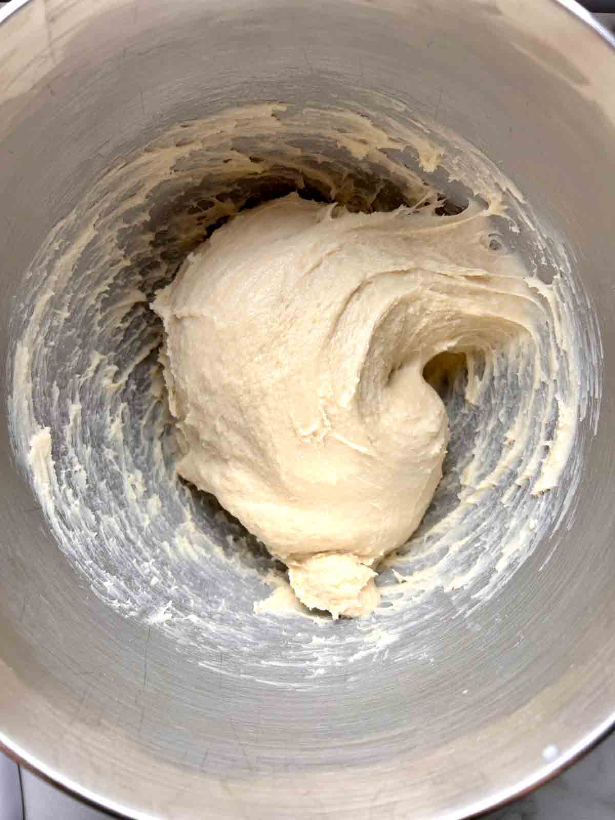dough coming together in stand mixer bowl.