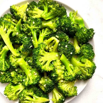 overhead shot of sautéed broccoli on plate.