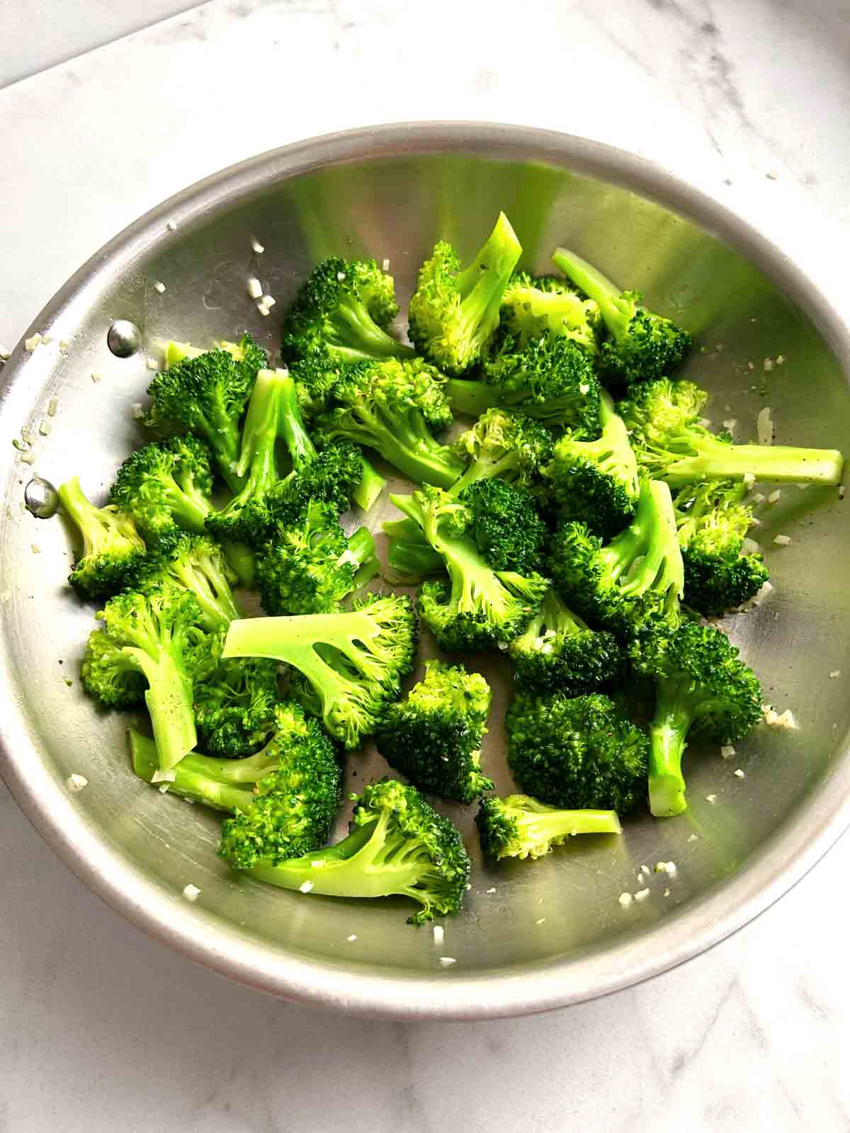 cooked broccoli in pan.