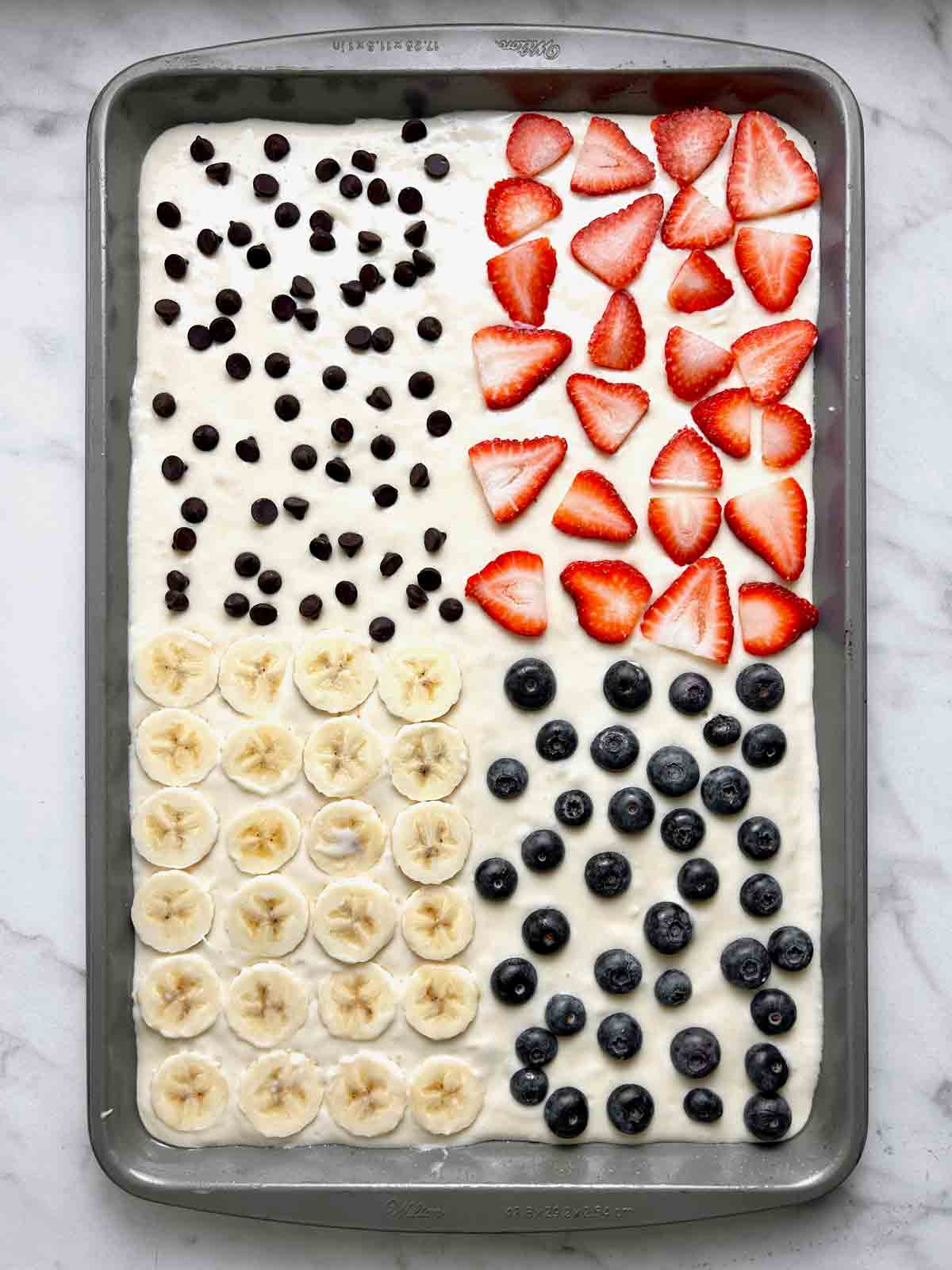 toppings added to 4 quadrants of batter.